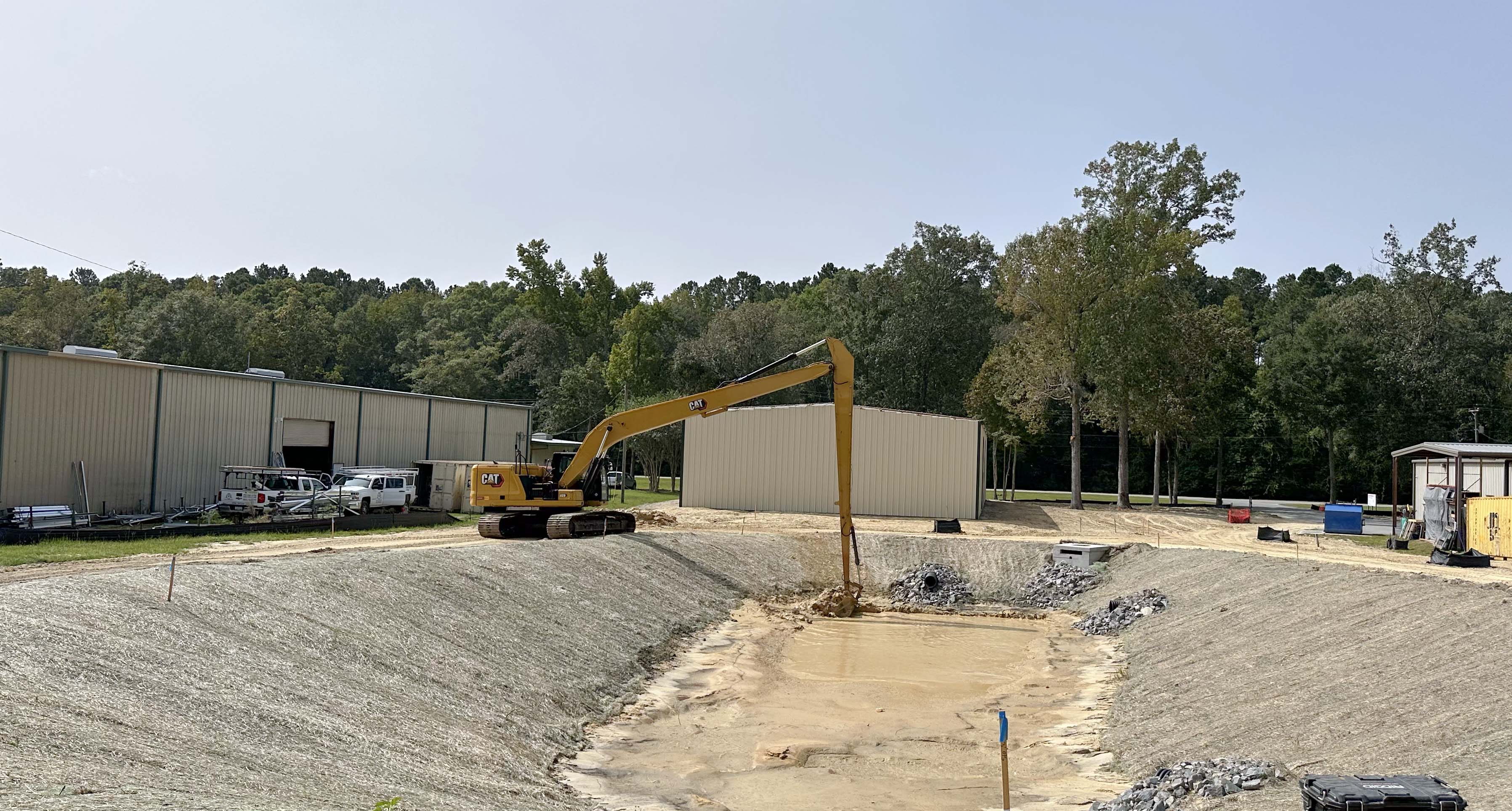 Excavator moving earth on a grading and earthwork project