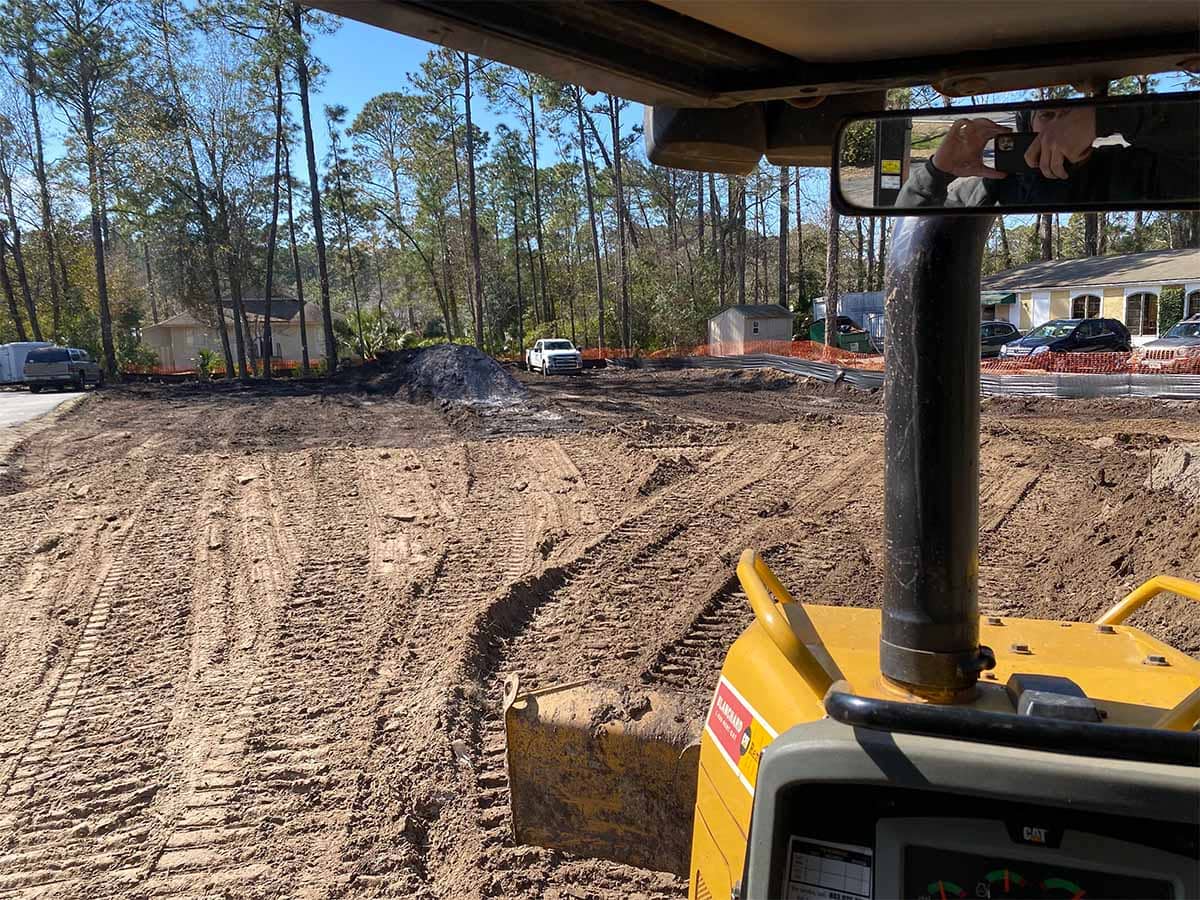 Site grading from excavator cab